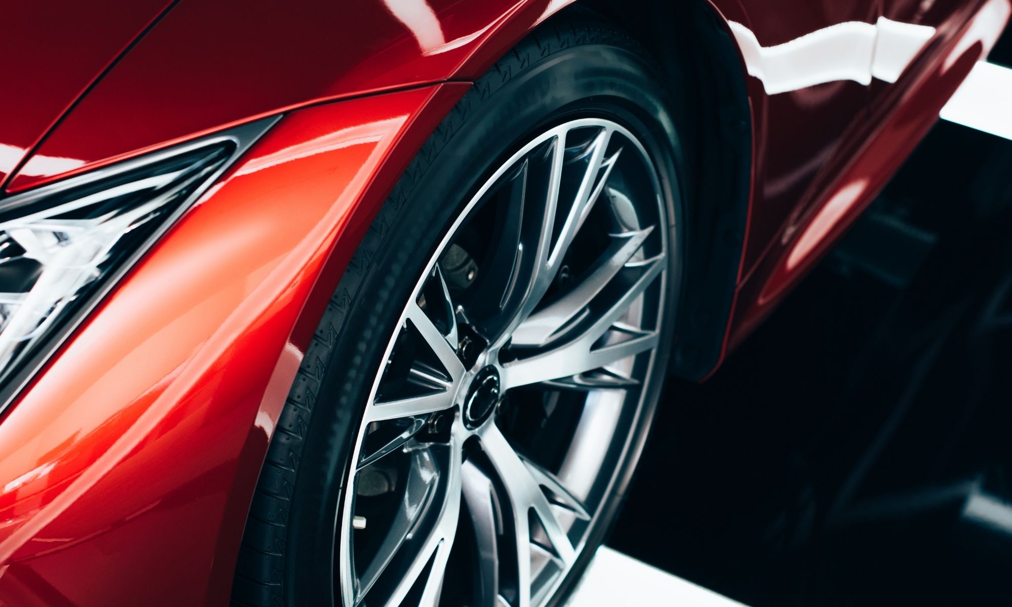 Polished wheel on red sports car